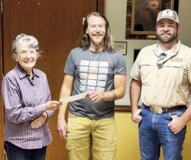 Jesse Ellgren (center) receives a scholarship check from Chihuahuan Desert Research Institute Director Emeritus Shirley Powell (left). He is also pictured here with Big Game Specialist Dr. Justin French of the Borderlands Research Institute. Photo courtesy of CDRI