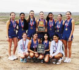 The Runnin’ Lady Bucks varsity cross country team brought home its third consecutive district title in Presidio last week. Courtesy Photo