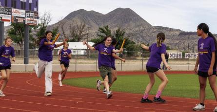 These Alpine 6th-grade girls give it everything they have in the relay race just before school ended at Buck Stadium. Courtesy photo