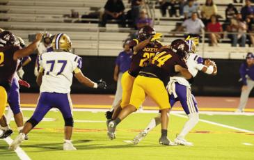 Two Kermit players contend with an Alpine player during the Buck’s matchup last Friday night. Courtesy photo