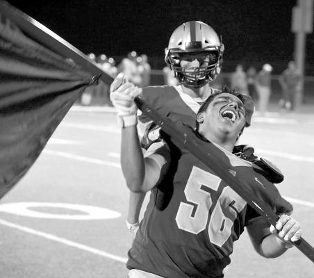 Fightin’ Buck Robert Vasquez celebrates the homecoming win after the game against Compass Academy last Friday. Photo by Noe Lujan.