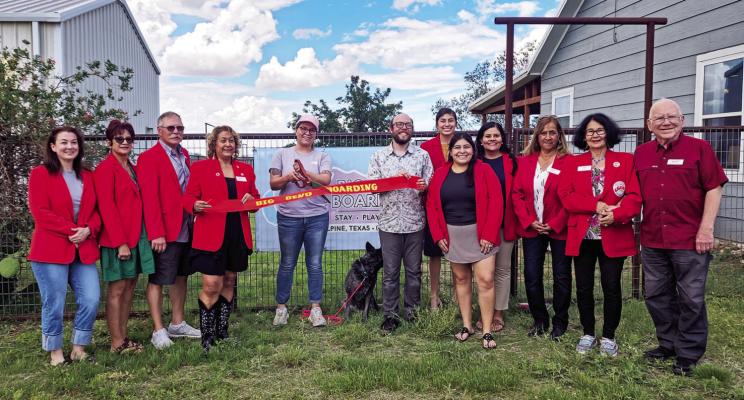 The Alpine Ambassadors welcomed Big Bend Boarding to the city on Saturday afternoon. Rachael Connally, Luna the Blue Heeler, and Alex Toder are the owners of this new animal boarding facility located at 504 Tom Lackey Lane. Photo by Kara Gerbert