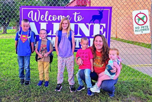 The Vaughn children are all set for their first day of school this year, along with their sister, who is a future Alpine Elementary student. Hugh, Caden, Kalynn, Benjamin, and baby Marian stopped for a photo with their mother, Penny, before school on Tuesday. Courtesy photo