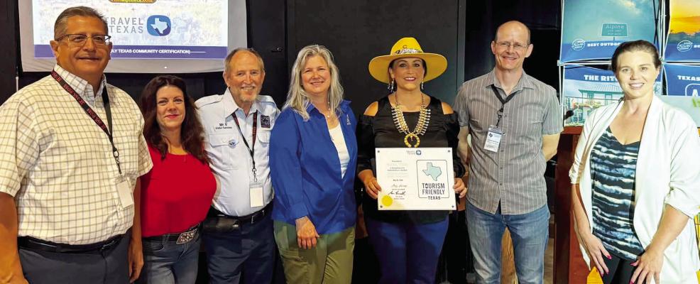 Representatives from Travel Texas were on hand last week at Alpine’s Regional Roundtable to present city representatives with an offi cial certifi cate designating the city as tourism-friendly. Pictured are Alpine City Manager Henry Arredondo, Alpine City Mayor Catherine Eaves, Alpine Visitor Center assistants Jory Vandenburg and Marsha Wells, Visit Alpine’s Tourism Administrator Heather Yadon, 