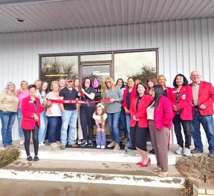 The IV Bar, owned and operated by Amy and Austin Stinnett held its grand opening and ribbon cutting on Friday evening. The Stinnett’s (center) were joined by friends and family and the Alpine Ambassadors. Photo by Kara Gerbert