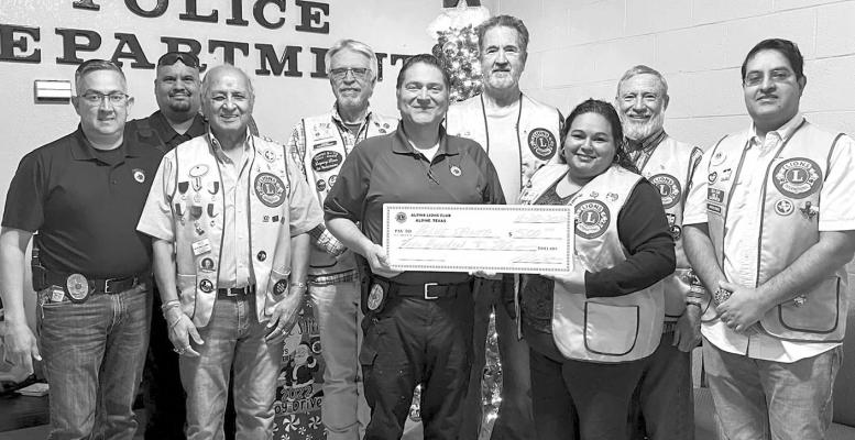 Members of the Alpine Lion’s Club presented a check to the Alpine Police Department’s Blue Santa program that distributes toys to members of the community each year at Christmas time. Courtesy photo