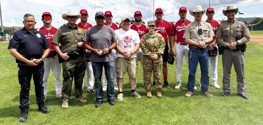 The Alpine Cowboys pose with First Responders in a recent home game at Kokernot Field. Courtesy photo