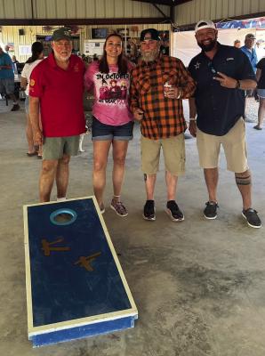 C.A.S.I. cookoff attendees blowing off a little steam at Krazy Flats with a cornhole tournament took a moment for a photo-op this past weekend in Terlingua.. Courtesy photo