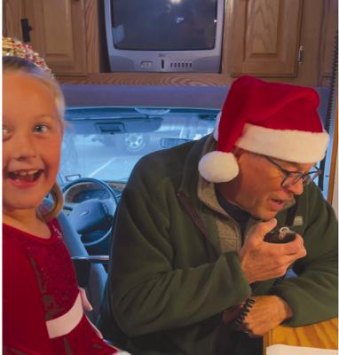 Emy Yadon had a chance to talk to Santa last Tuesday evening at Morrison’s True Value Hardware, thanks to efforts from the Big Bend Amateur Radio Club. One of Santa’s elves, Dr. Rob Kinucan was on hand to help work the shortwave radio used to contact the North Pole. Photo courtesy of Heather Yadon