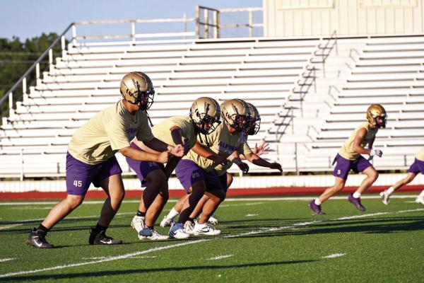 The defense exhibits how they work together to help stop opponents from scoring during Alpine’s Purple and Gold night before they hit the road last Friday to take on McCamey. Photo by Felipe Fierro