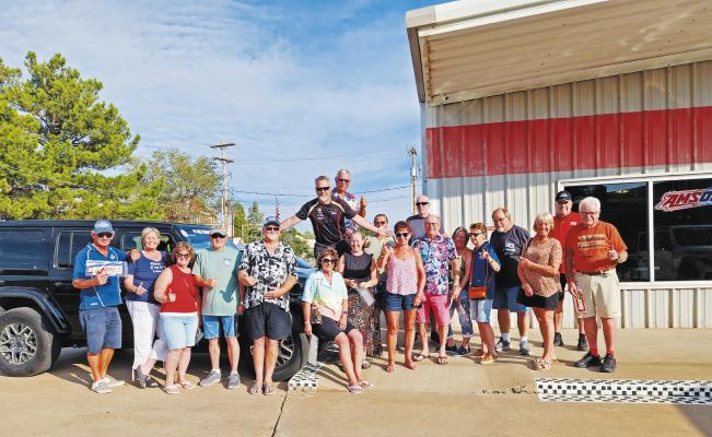 This group of car enthusiasts from Australia and New Zealand spent some time at The Stable to take a look at some of the classic and newer-model sports cars on display Monday morning. The tour group, Kiwis On Tour NZ, will be visiting eight cities in Texas, including Alpine, along with several others in Utah, Arizona, New Mexico, and California. Photo by Kara Gerbert