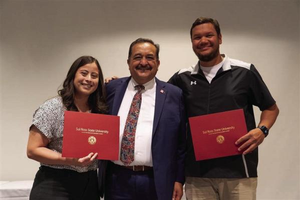 Retention Specialist Samantha Sanchez and Assistant Athletic Director for Internal Operations Clayton Garcia were presented with the 2025 Bar-SR-Bar Award by President Carlos Hernandez (center) last Tuesday at the Morgan University Center. Employees of Sul Ross are nominated by their peers and chosen by the Staff Excellence Award Committee. These two staff members were also awarded a $1,000 stipend. Courtesy photo