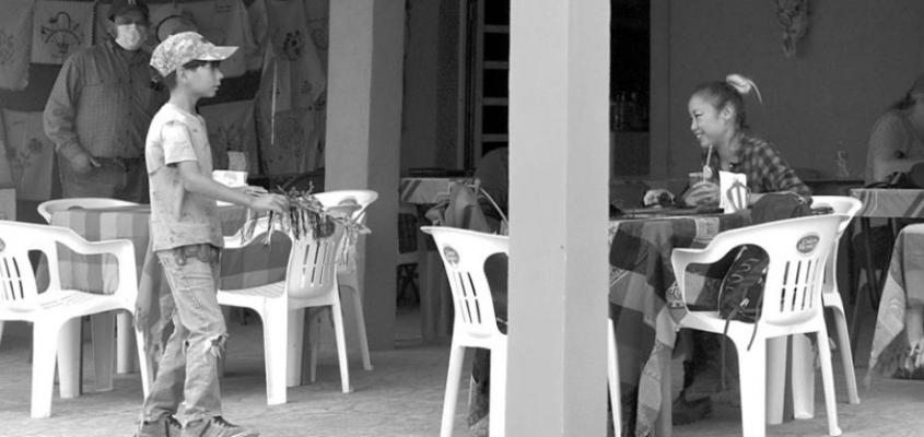 A child approaches diners hoping to make a sale at Boquillas Restaurant. Ernesto Hernandez (not pictured) is hoping a push for ecotourism will provide more sustainable, long-term opportunities for Boquillas residents.