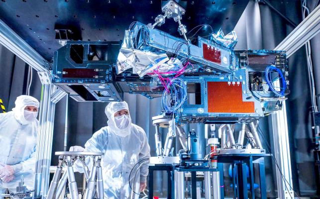 NASA engineers inspect the Roman Coronograph instrument’s optical path, which will feed light from the telescope into the instrument. Photo courtesy of NASA