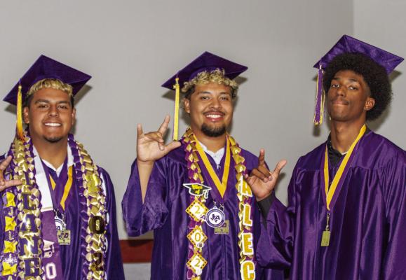 Seniors A.J. Llanez, Alec Ramos, and Dae Hardwick made their mark on the field, on the court, and in the classroom while at Alpine High School, but even after they walked across the stage at Friday night’s graduation ceremonies, they still considered themselves to be Fightin’ Bucks. Photo by Kara Gerbert