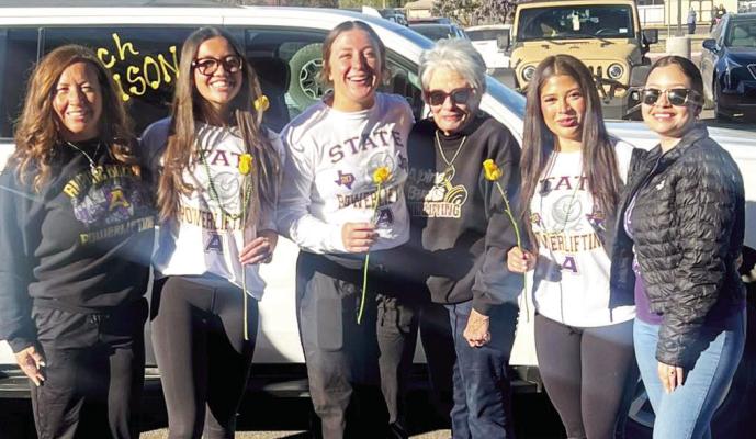 Naida Morris, Kody Hawkins, and Vianney Santos are prepared to head to Edinburgh for the girls’ state powerlifting competition that began yesterday. These young athletes are pictured with their mothers and grandmother as they prepared to leave on Tuesday morning. Courtesy photo