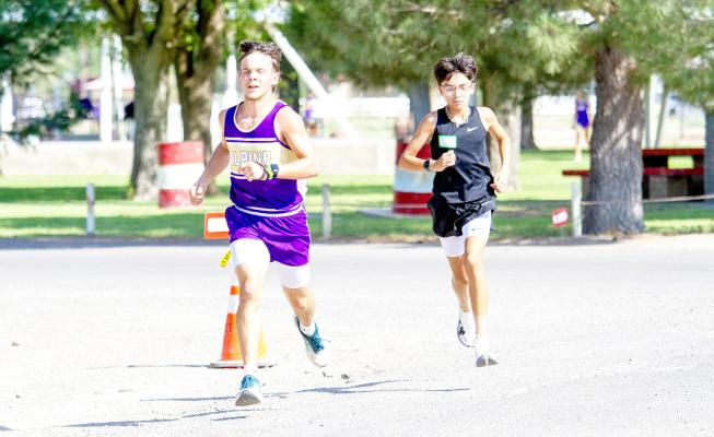 Senior Everett Edwards rounds a corner during the West of the Pecos Cross Country meet held on August 8. Edwards placed just outside the top 10, with an 11th-place finish against a tough group of runners. Photo by Kara Gerbert