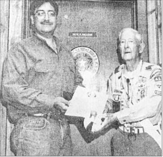 August 17, 1995 — State Rep. Pete Gallego, left, presents Charles E. Wade of Alpine with a certificate from the Texas House of Representatives recognizing Wade’s 70 years as an Eagle Scout.