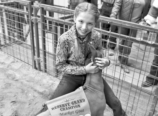 Hallie Wood shows off her Reserve Grand Champion goat at last year’s Big Bend Livestock Show. Photo by Felipe Fierro