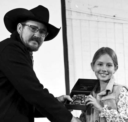 Aaron Renfroe presents a buckle to Lauren Aragon for her Grand Champion Gelding at this year’s BBLSA Horse Show. Courtesy photo
