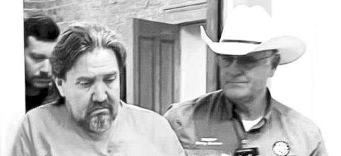 Brewster County Sheriff escorts Michael Spitzer to the county jail. Courtesy photo