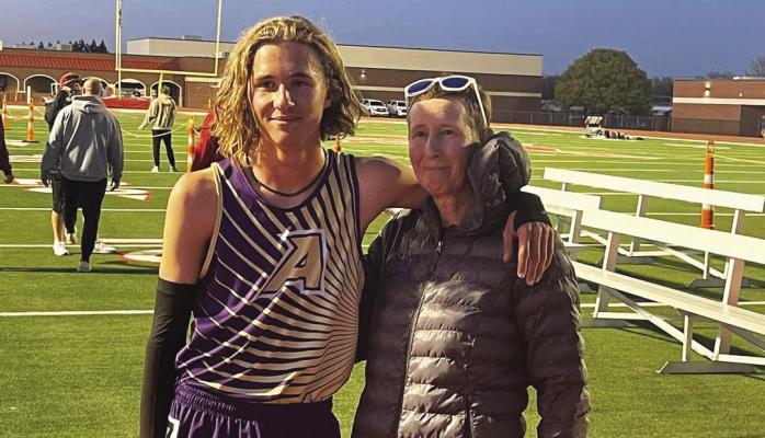 Hatfield Cason took his first-place District win in the 3200M race to the Area competition in Denver City last week and came home with the same result, placing first and advancing to the Regional meet in Abilene this Friday. Pictured are Hatfield and his mom, Lady Bucks head track coach Cory Cason. Courtesy photo