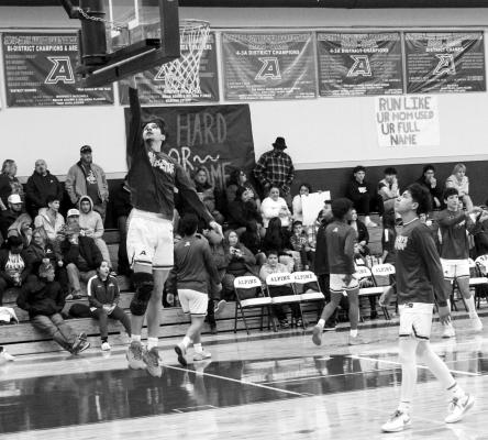 Ferris Daley exhibits a little hang-time during the Alpine Fightin’ Buck’s warm-up prior to their game against Kermit on Tuesday night. Photo by Joh Covington