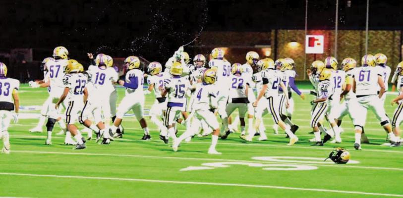 The Fightin’ Bucks celebrate their Bi-District victory over Grape Creek on Nov. 12 in Kermit. Photo by Felipe Fierro