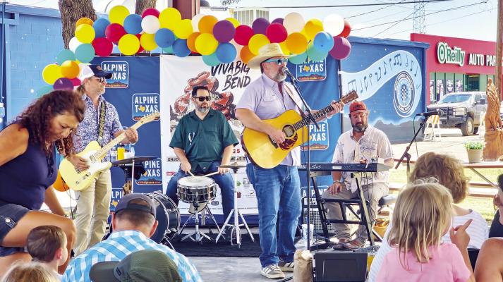 The Mr. Will Show, put on each year by Visit Alpine and Will Dupuy is always a hit on Saturday afternoons at the Visitor Center pavilion. Dupuy plays children shows across the state. Pictured are Chris McWilliams, Will Dupuy, Michael Leftkowitz, and Neil Trammell. Photo by Kara Gerbert