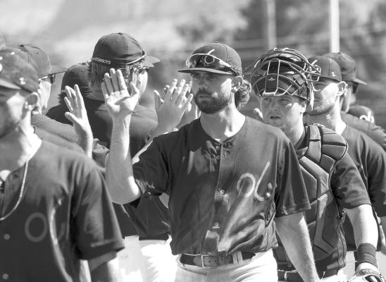 The Alpine Cowboys celebrate their victory in the first game of a doubleheader over the Roswell Invaders July 4 at Kokernot Field. Alpine won six of eight games in their last homestand. Photo by Julie Myers