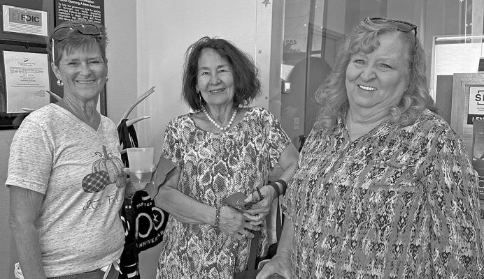 Judy Stokes, Sara Bow, and Linda Harris were on hand last week for TransPecos Banks’ 100 years of banking celebration. Photo by J.T. Maroney