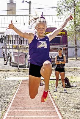 Long jumper Kylie Maroney floats through the air towards her second- place varsity long jump attempt during last Thursday’s District track meet. Photo by Kara Gerbert