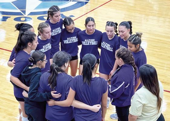 It’s not just the football team that gathers in a huddle. The Alpine Lady Bucks volleyball team also initiates this sports action, gathering together to listen to instructions from their coach. Photo by Sonia Ybarra