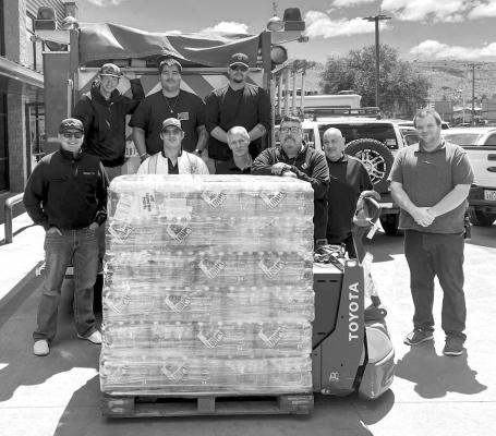 Lowe’s Market in Alpine recently donated a pallet of drinking water (84 cases) to the Alpine Volunteer Fire Department for use during this year’s wildfire season that is currently underway. Photo courtesy of AVFD