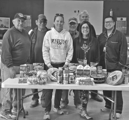 Big Bend Post 79 of the American Legion recently donated meals to needy families at Alpine ISD just in time for Christmas. From left are Andy Ramos, Martin Sandate, Amy White, John Sutterfield, Caroline Fox, Jim Sullivan, and Chris Valenzuela. Courtesy photo