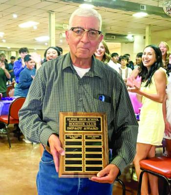 The Alpine High School sports banquet was held on Wednesday, May 6, where not only the high school athletes were honored. Above: Long-time bus driver for AISD Jesse Ybarra was recognized with the 2026 AHS Booster Club Impact Award. Below: Also recognized for their support of AHS sports were Mr. and Mrs. Robert Polanco, who were recognized as Buck Super Fans. Courtesy photos