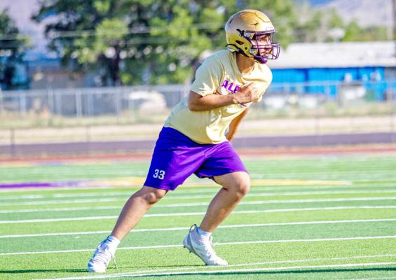 Alpine’s Julian Aguilar runs drills earlier this month during an afternoon practice at Buck Stadium. Photo by Kara Gerbert