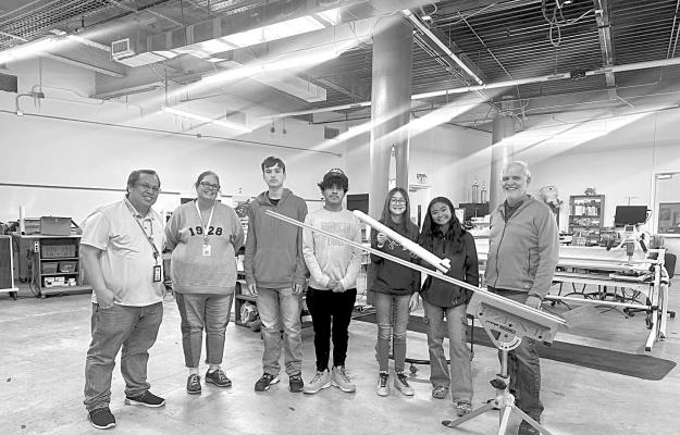 The Alpine Middle School rocketry team is pictured with their first contest rocket and rocket launcher for the American Rocketry Challenge (ARC.) The rocketry team is sponsored by Mr. Creer-AMS, Wanda Green-ARC, Rosalynn Larsen, and Dr. Bill Kitch-ARC. Pictured are Mr. Rodelio Creer, Rosalynn Larsen, Cain Vidal, Ryan Hinojos, Elisia Markin, Rose De Guia, and their ARC mentor Dr. Bill Kitch of San Angelo. Courtesy photo