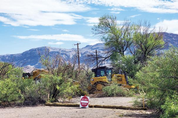 Heavy equipment rests silently on Sunday, August 16, after the border wall infrastructure began last week in Big Bend National Park. These machines were parked just past the turnoff to Cottonwood Campground, and the “new patrol road” essentially runs parallel to the already paved and maintained park road to Santa Elena Canyon. As of Sunday, the path runs from the parking lot at Santa Elena Canyon to this location. Photo by Kara Gerbert