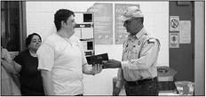 Dispatcher Christian Davis was presented with a plaque and stork pin by Sheriff Danny Dominguez during a ceremony held last Thursday at the Presidio County Sheriff’s Office. Courtesy photo