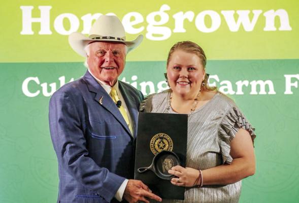 Amanda Lujan, the nutrition director for Alpine ISD, was recognized at the Texas Department of Agriculture’s Mega Con last Friday. Lujan won the Chef Coat giveaway from Texas’ Farm Fresh Challenge, and she was honored for her leadership in serving nutritious meals to Alpine children. Courtesy photo