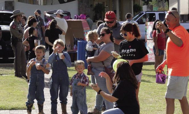 Parents and kids galore enjoyed the Big Bend Law Enforcement Fun Fest held at the Alpine Visitor’s Center on Saturday. Activities included trunk or treat, music, games, food and drinks, and free pumpkins for the kids courtesy of the Alpine Police Department and Porter’s. Photo by Joh Covington