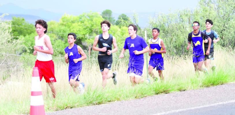Buck Middle School cross country racers Santiago Brito and Davis Edwards conquer the hill on Saturday morning during the Big Bend Mountain Ramble. Photo by Kara Gerbert