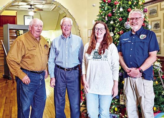 The Brewster County Commissioners Court took time for a photo after their last meeting of the year. The court is Mo Morrow, Judge Greg Henington, Sara Colando, and Jim Westermann. Photo by Kara Gerbert