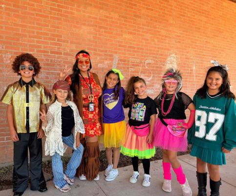 These Alpine Elementary students took full advantage of homecoming week’s dress-up days, as they exhibited both recent and past decades in their costumes. Courtesy photo