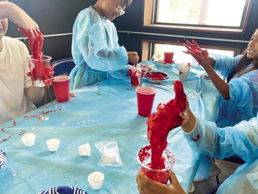 Kids at the Marathon Public Library’s Discovery Summer Camp learned about what’s inside the body: red cells, white cells, platelets, and plasma, using the blood slime model. Photo courtesy of Marathon Public Library