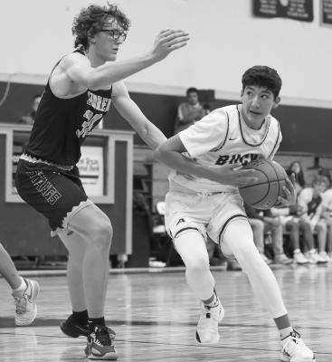Jace Canaba goes in for the layup in one of last season’s games in Alpine against a player from Andrews. Photo by Shawn Yorks