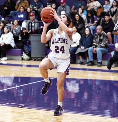 Lady Buck returner Gyllian Morrissey shoots a layup against the Kermit Lady Jackets last season at the Buck Dome. Photo courtesy of Felipe Fierro