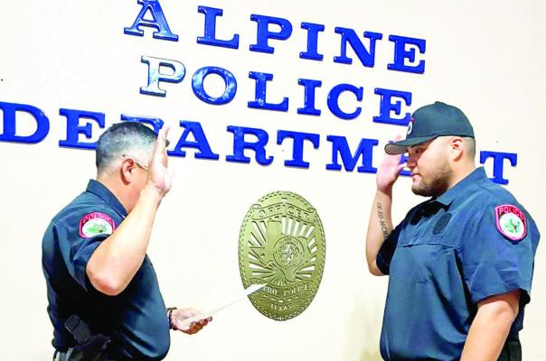 Alpine Police Chief Darrell Losoya administers the oath of office to Alpine Police Department’s newest officer, Gabriel Campos. Campos is a recent graduate of the Joaquin Jackson Peace Offi cer Academy at Sul Ross State University and an Alpine native. Photo courtesy of Alpine Police Department