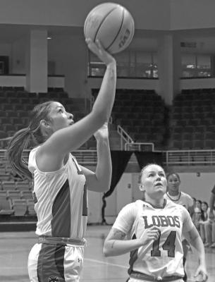 Sul Ross Lady Lobo Melody Martinez goes for a jumper as teammate Caitlyn Corley looks on. Photo courtesy of Sul Ross Sports